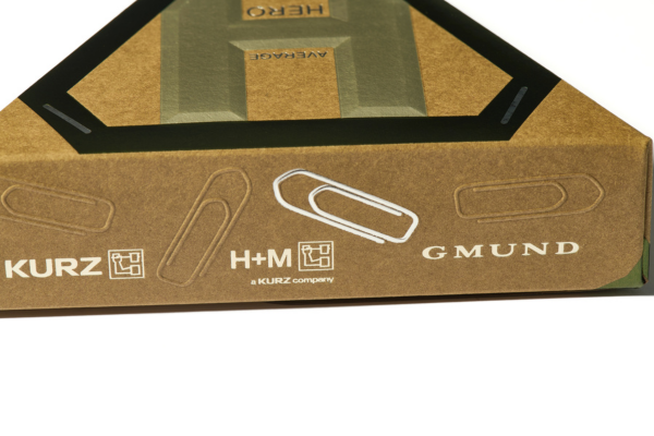 Packaging sample with gold hot foil stamping, blind embossing and MicroEmbossing showing a paper clip design